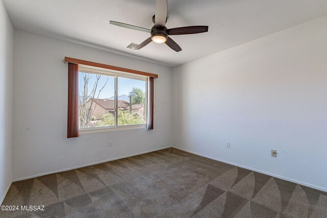 unfurnished bedroom featuring a closet, carpet floors, and ceiling fan