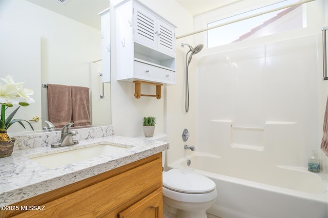 full bath with vanity, toilet, and shower / washtub combination