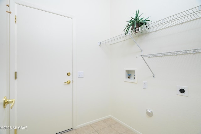 laundry area featuring laundry area, baseboards, washer hookup, light tile patterned floors, and hookup for an electric dryer