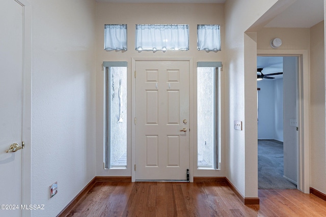 entryway featuring hardwood / wood-style flooring and ceiling fan