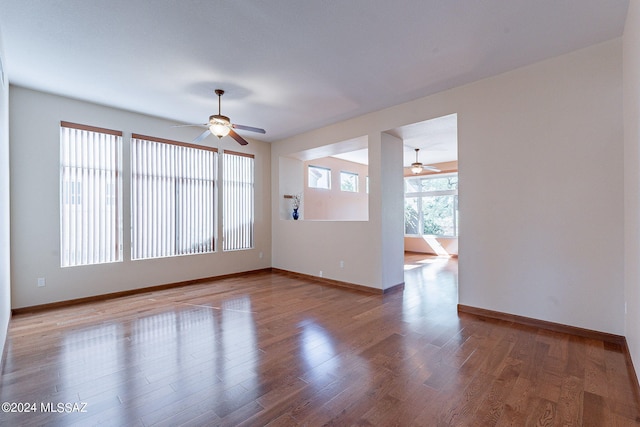 interior space with hardwood / wood-style floors and ceiling fan