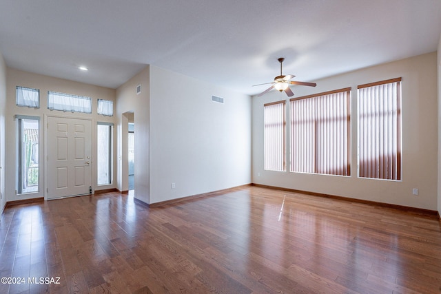 entryway with dark hardwood / wood-style floors and ceiling fan