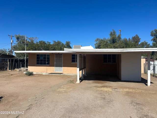 ranch-style house with a carport