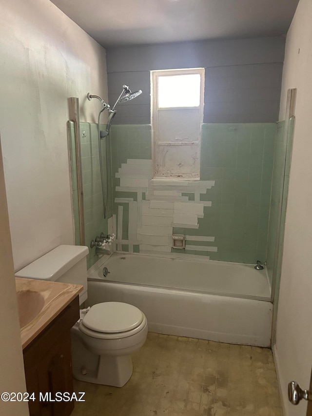 full bathroom with vanity, toilet, and tiled shower / bath combo