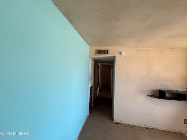 corridor featuring concrete flooring