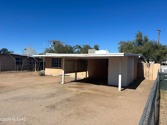 exterior space with a carport