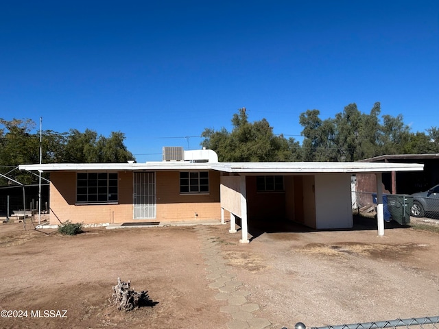 ranch-style house with a carport