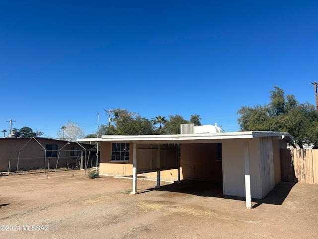 exterior space with a carport