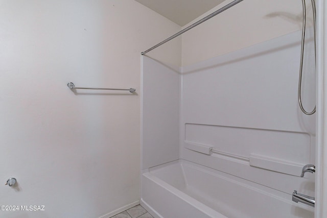 bathroom with tile patterned flooring and shower / bathtub combination