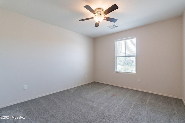 unfurnished room with ceiling fan and carpet flooring