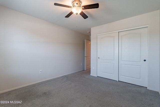 unfurnished bedroom with a closet, carpet, and ceiling fan