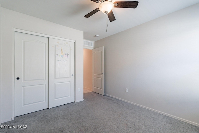 unfurnished bedroom with a closet, ceiling fan, and light colored carpet