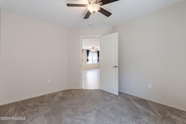 carpeted empty room with ceiling fan