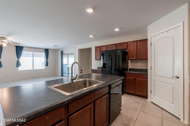 kitchen with light tile patterned floors, black appliances, sink, and ceiling fan