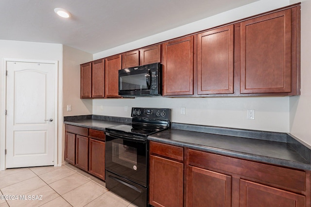 kitchen featuring black appliances and light tile patterned floors