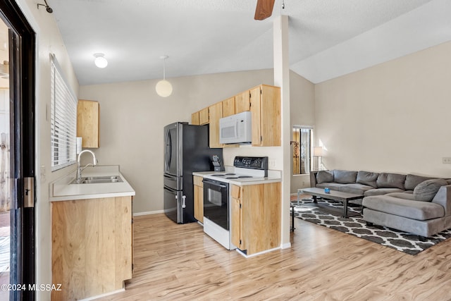 kitchen with light hardwood / wood-style floors, lofted ceiling, sink, and white appliances