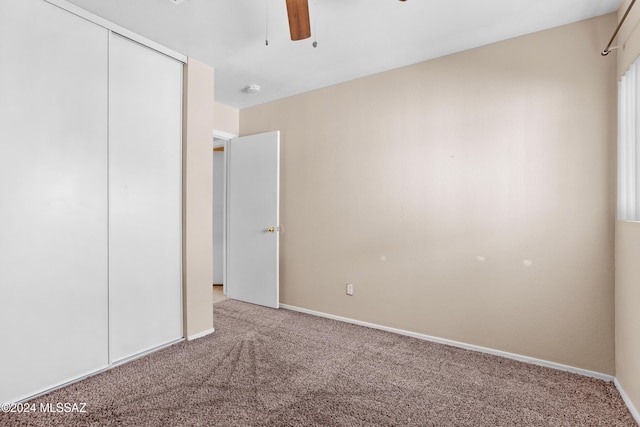 unfurnished bedroom with carpet flooring and ceiling fan