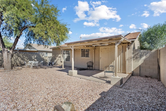 rear view of property featuring a patio area