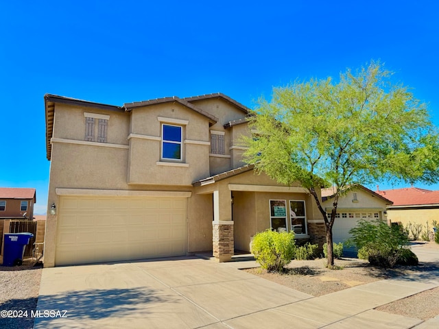 view of front of property with a garage