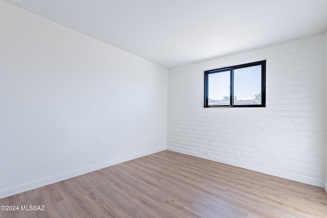 unfurnished room featuring light hardwood / wood-style floors