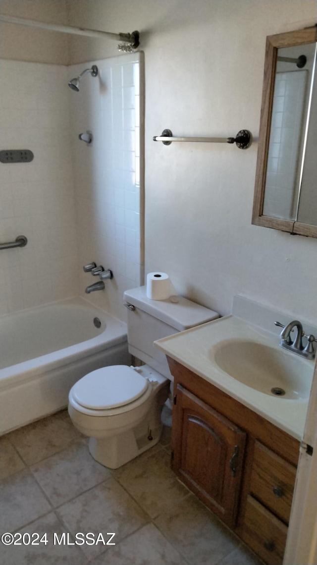 full bathroom with vanity, tile patterned flooring, toilet, and tiled shower / bath