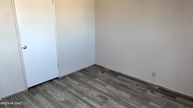 spare room featuring dark hardwood / wood-style floors