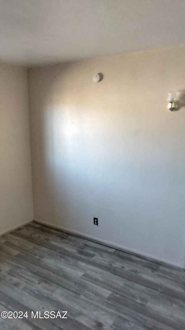 empty room featuring dark hardwood / wood-style floors