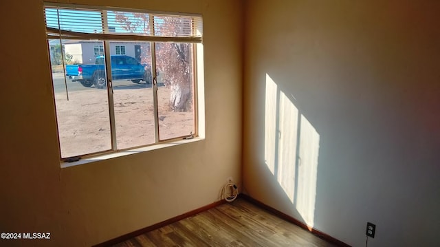 unfurnished room featuring wood-type flooring