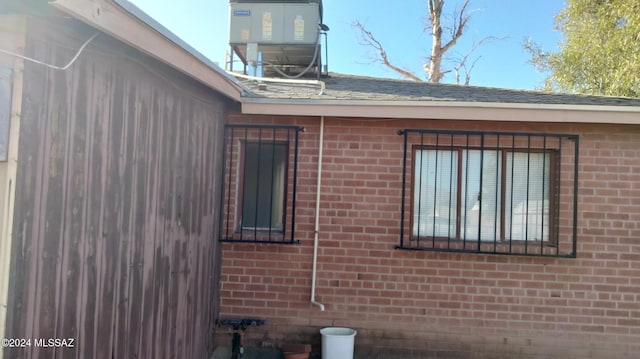 view of side of home featuring central air condition unit