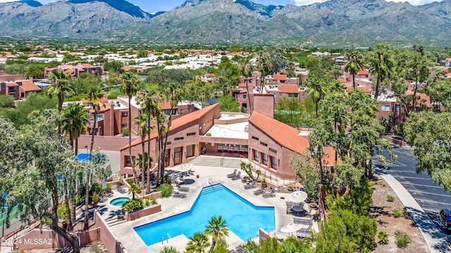 birds eye view of property featuring a mountain view