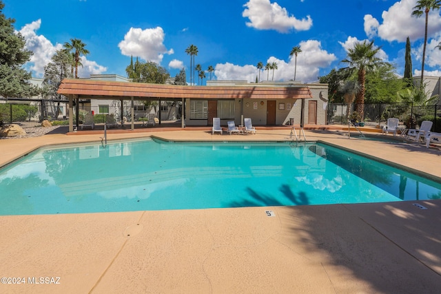 view of swimming pool with a patio