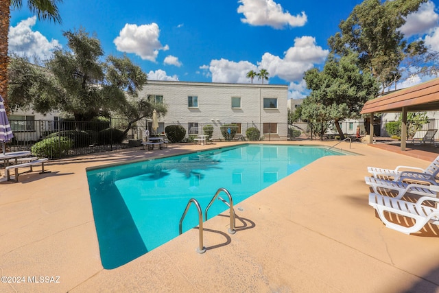 view of swimming pool featuring a patio