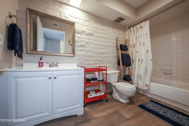 full bathroom featuring vanity, shower / bath combo with shower curtain, wood-type flooring, and toilet