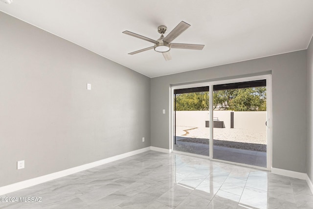 spare room with ceiling fan