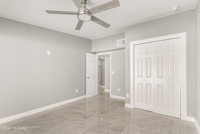 unfurnished bedroom with a closet and ceiling fan