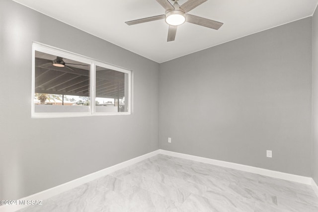 spare room with ceiling fan