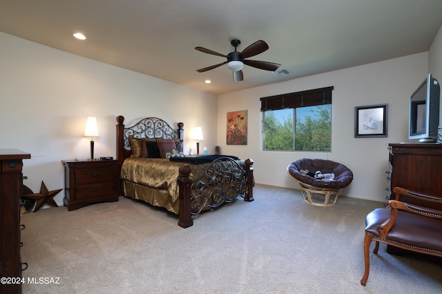 bedroom with light carpet and ceiling fan