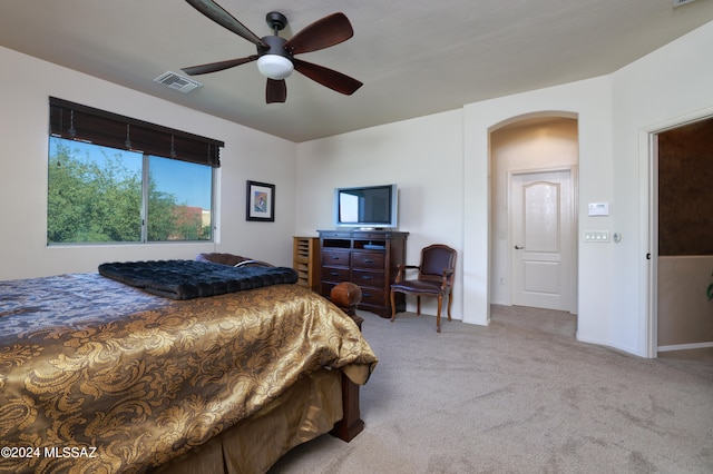 bedroom featuring ceiling fan and light carpet