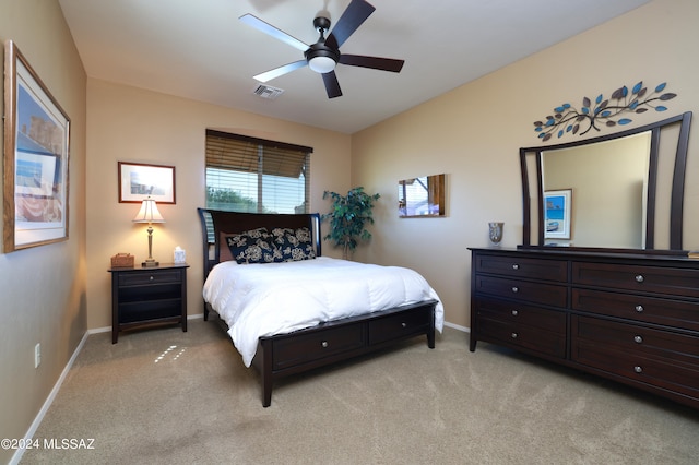 bedroom featuring light carpet and ceiling fan