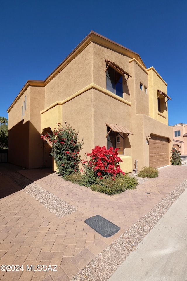 view of property exterior with a garage