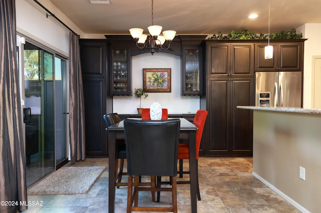 dining area featuring a chandelier