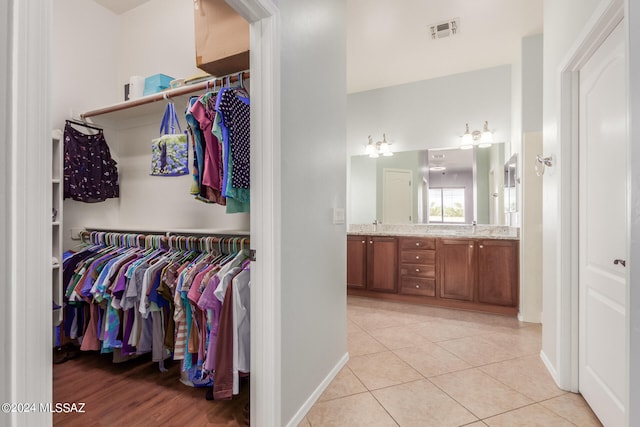 interior space with vanity and tile patterned flooring