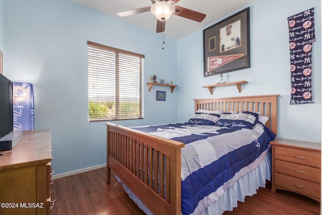 bedroom with dark wood-type flooring and ceiling fan