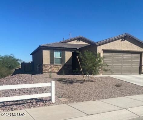 single story home featuring a garage