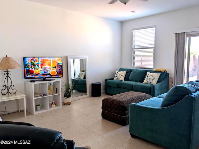 living room featuring tile patterned floors and ceiling fan