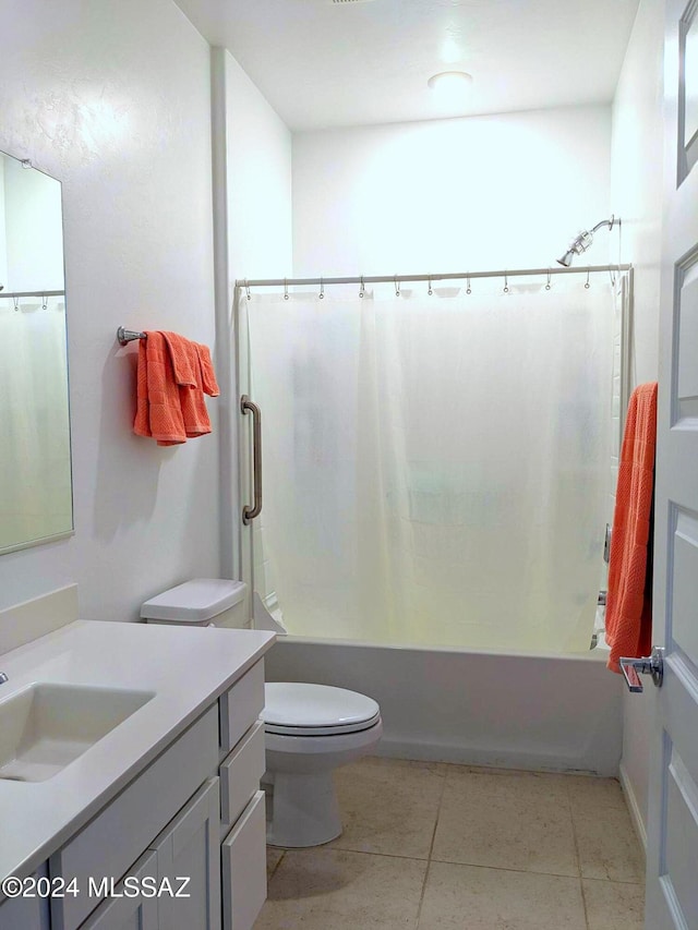 full bathroom with shower / bath combo with shower curtain, vanity, toilet, and tile patterned floors