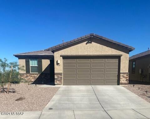 single story home featuring a garage