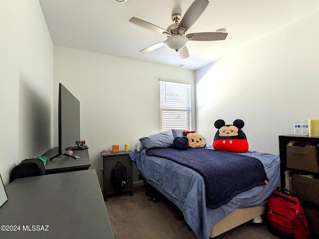 bedroom featuring dark colored carpet and ceiling fan