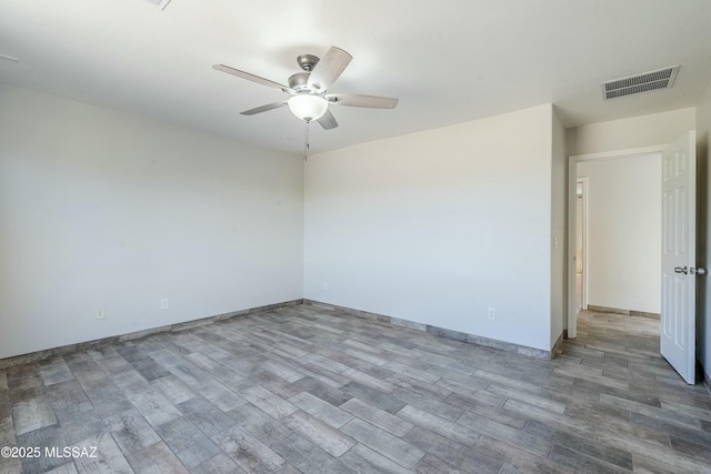 spare room featuring ceiling fan and wood-type flooring