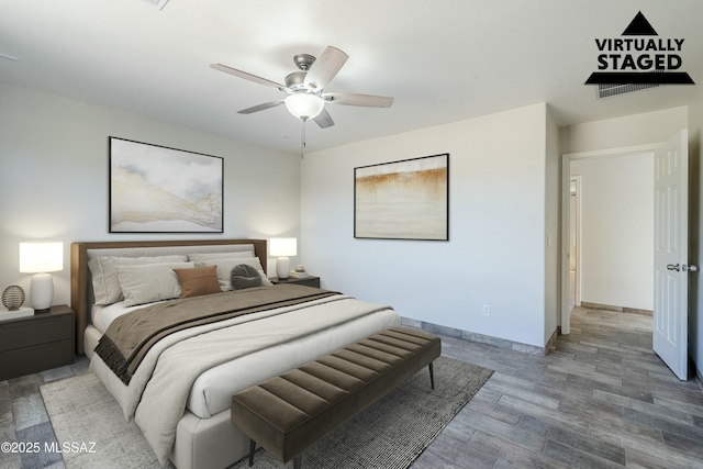 bedroom featuring ceiling fan and wood-type flooring